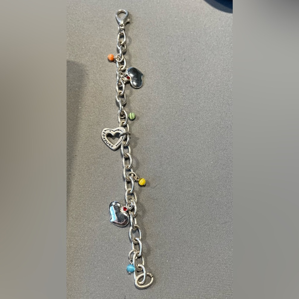 Fabulous 7” silver tone bracelet with heart charms and colorful beads.